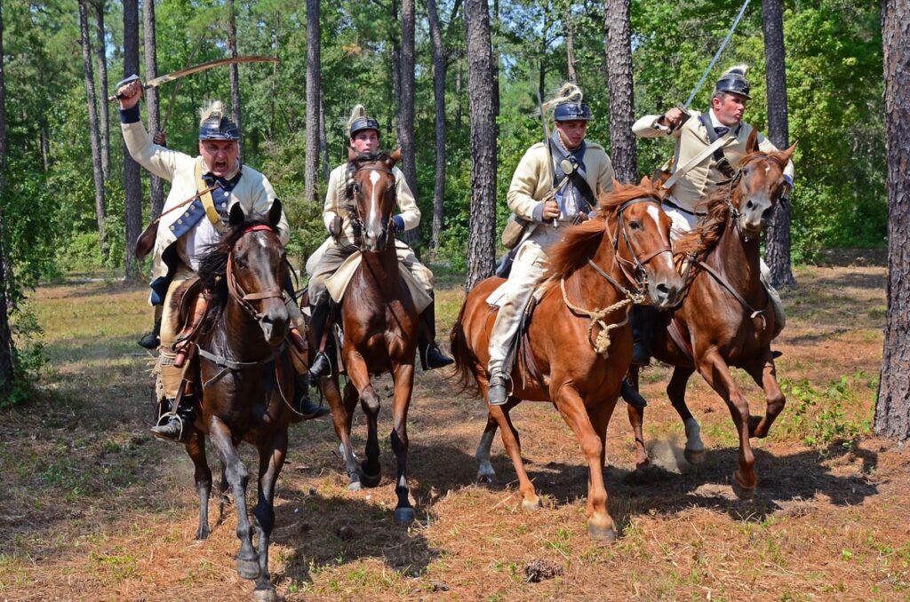 Group of reenactors on horses. 