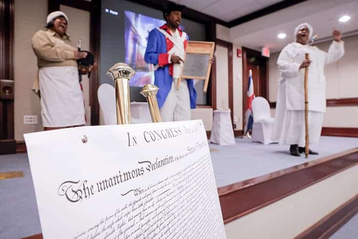 Revolutionary War reenactors perform